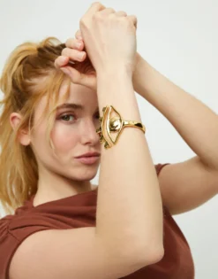 Bangle bracelet with a striking central eye