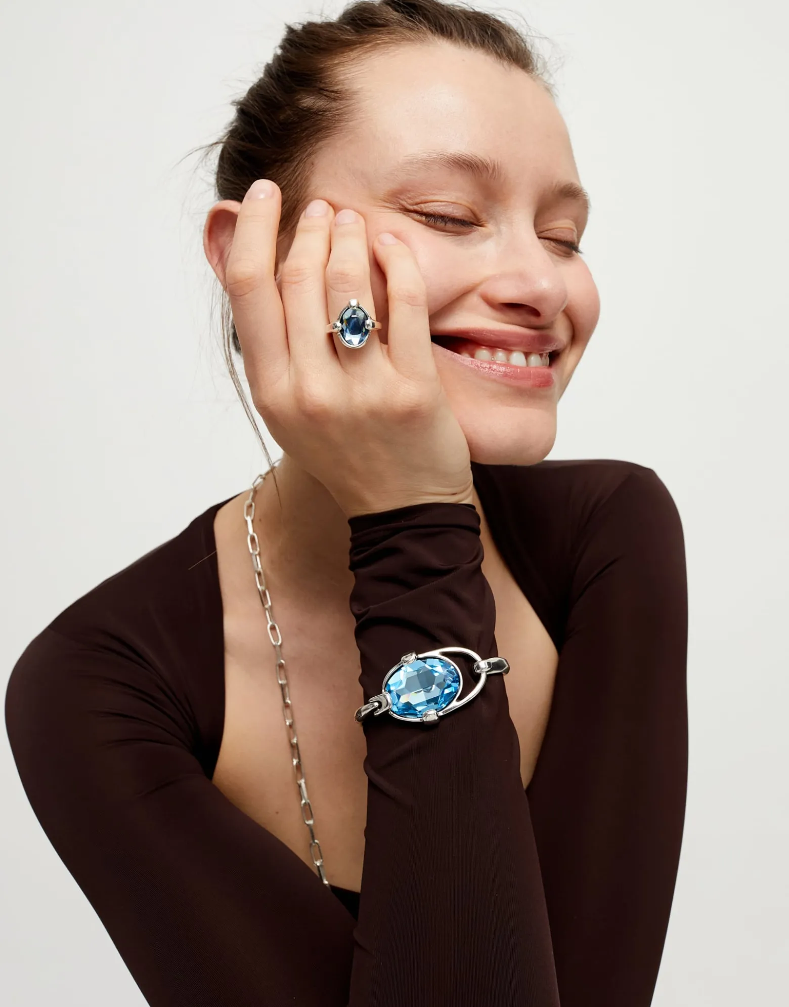 Bangle bracelet with faceted blue crystal