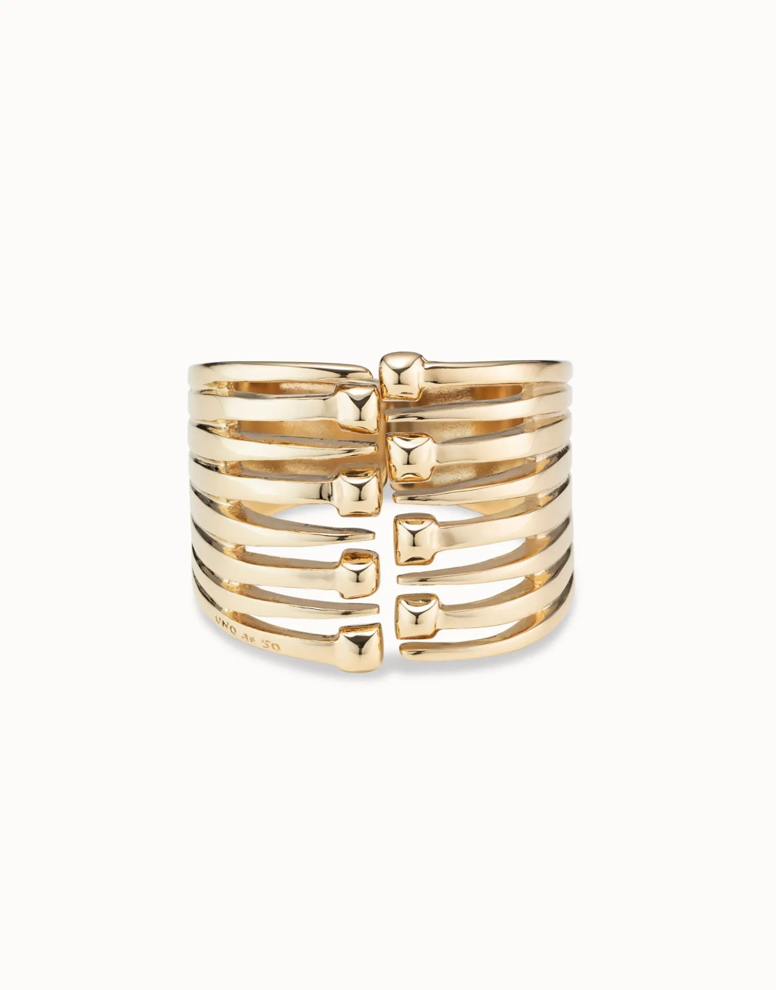 Bangle bracelet with multiple nail heads