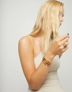 Bangle bracelet with multiple intertwined organic shapes
