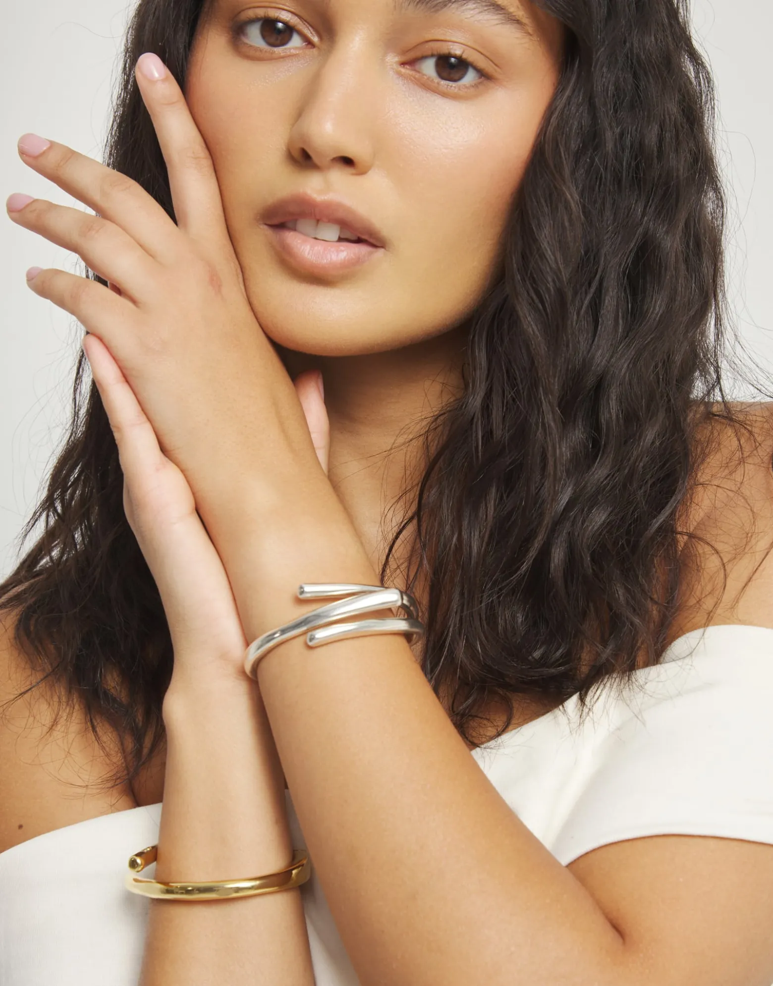 Bangle bracelet with three intertwined organic shapes