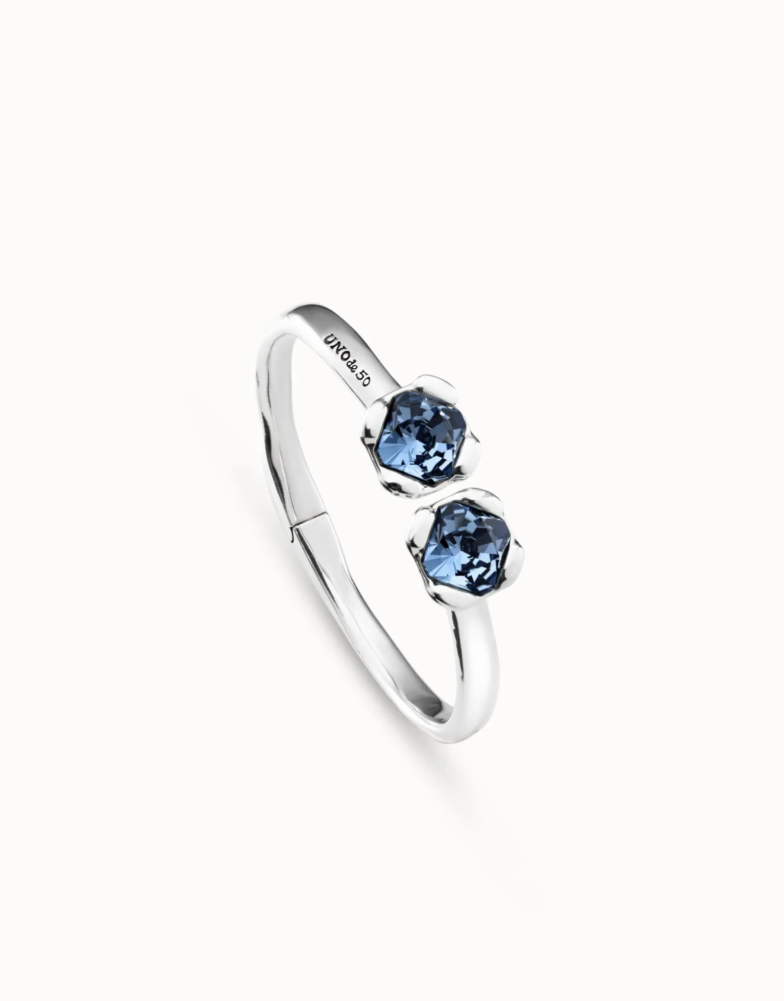 Bangle bracelet with two blue crystals