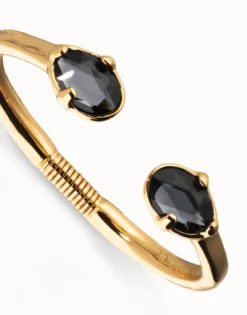 Bangle bracelet with two faceted black oval crystals
