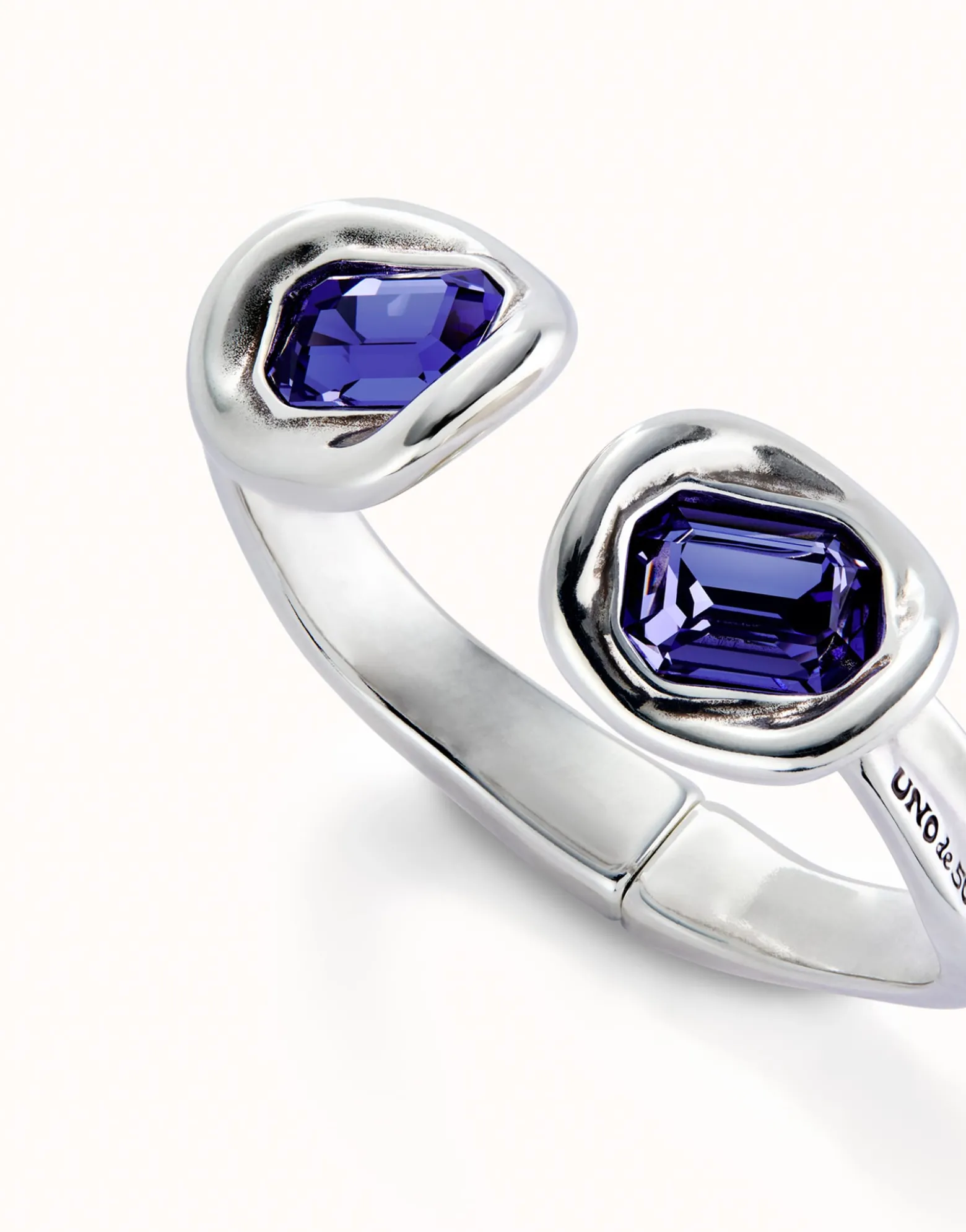 Bangle bracelet with two purple crystals