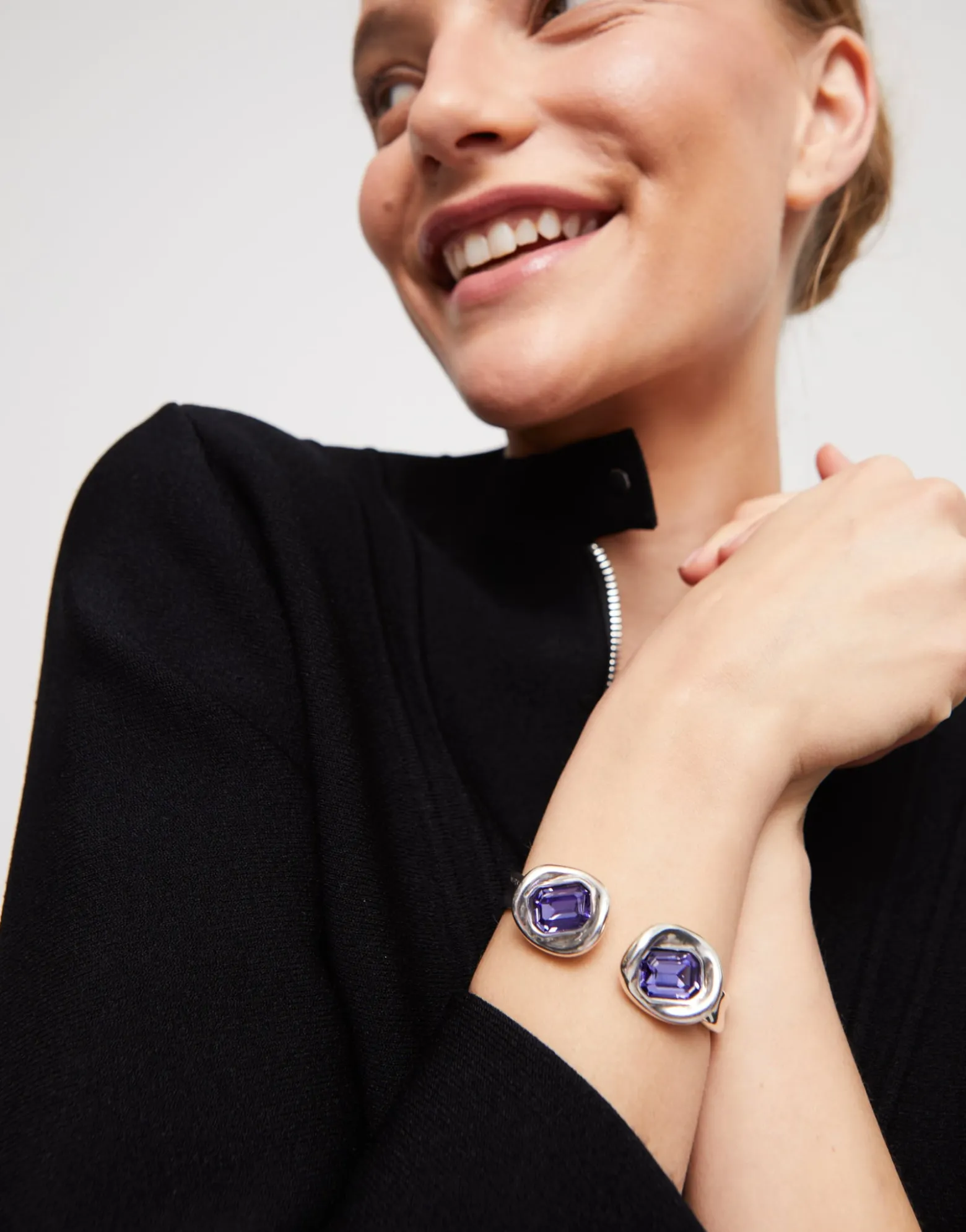 Bangle bracelet with two purple crystals