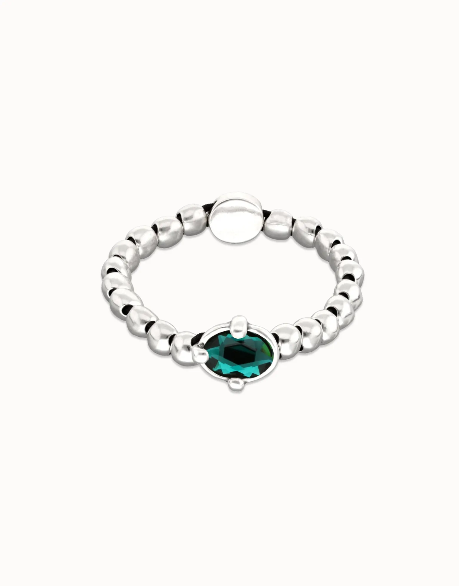 Beaded bracelet with oval faceted green crystal