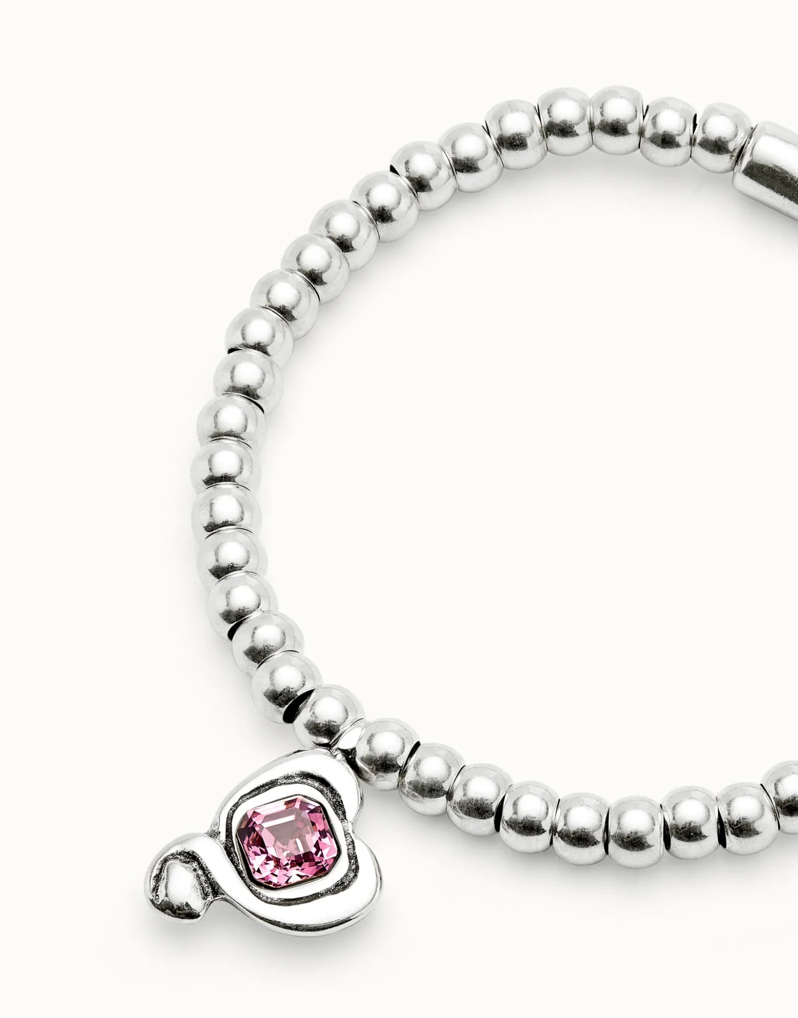 Beaded stretch bracelet with heart and pink crystal