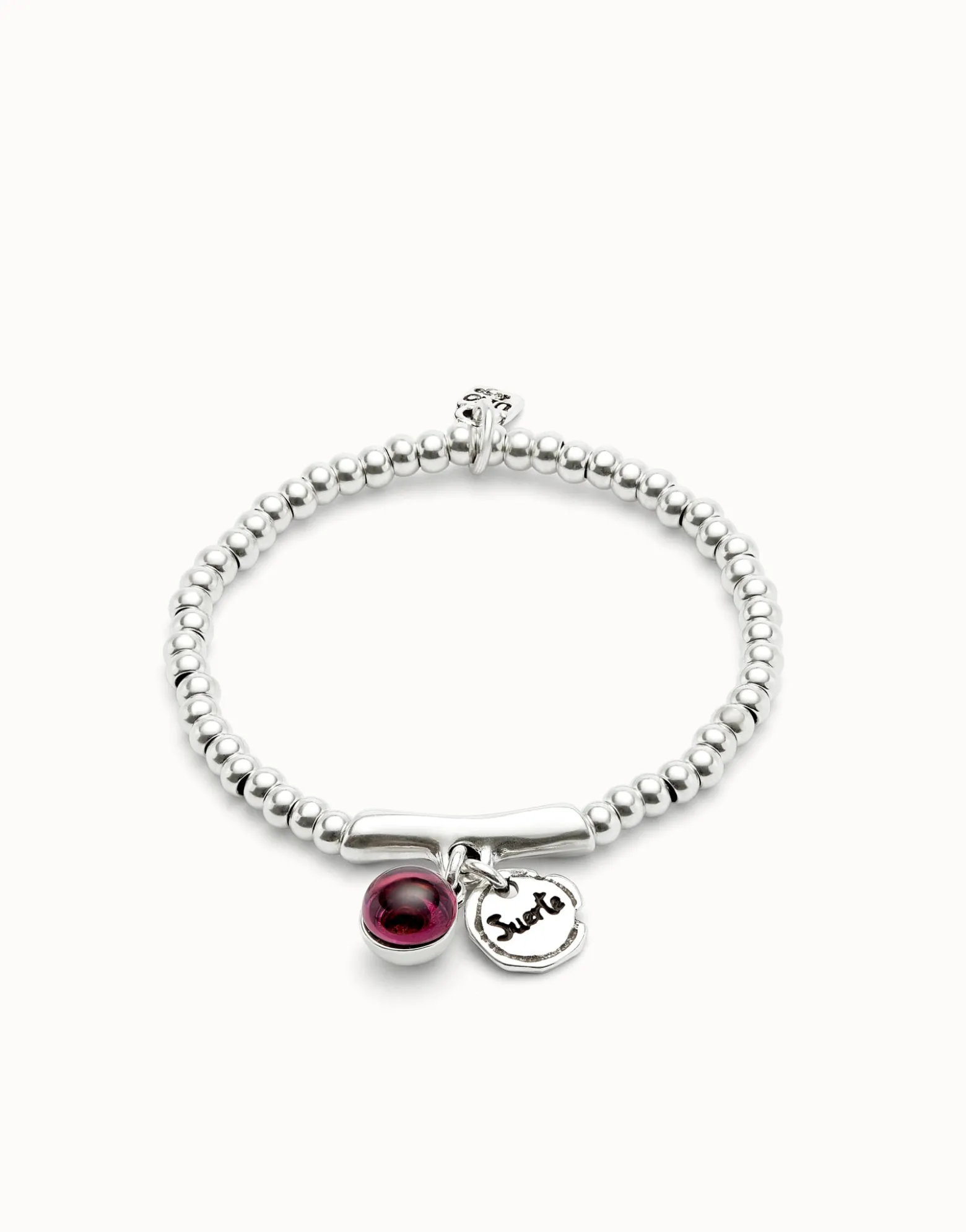Beaded stretch bracelet with a murano glass and the word lucky