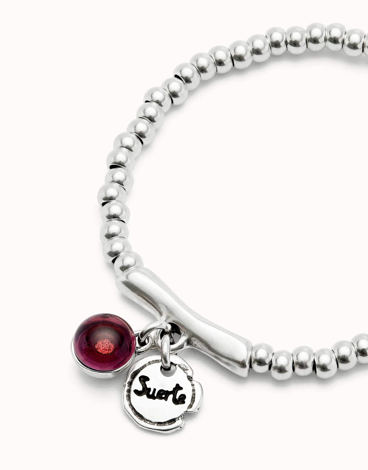 Beaded stretch bracelet with a murano glass and the word lucky