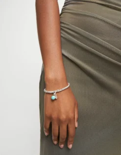 Beaded stretch bracelet with a murano glass and a hamsa