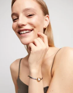 Black cord bracelet with a pearl