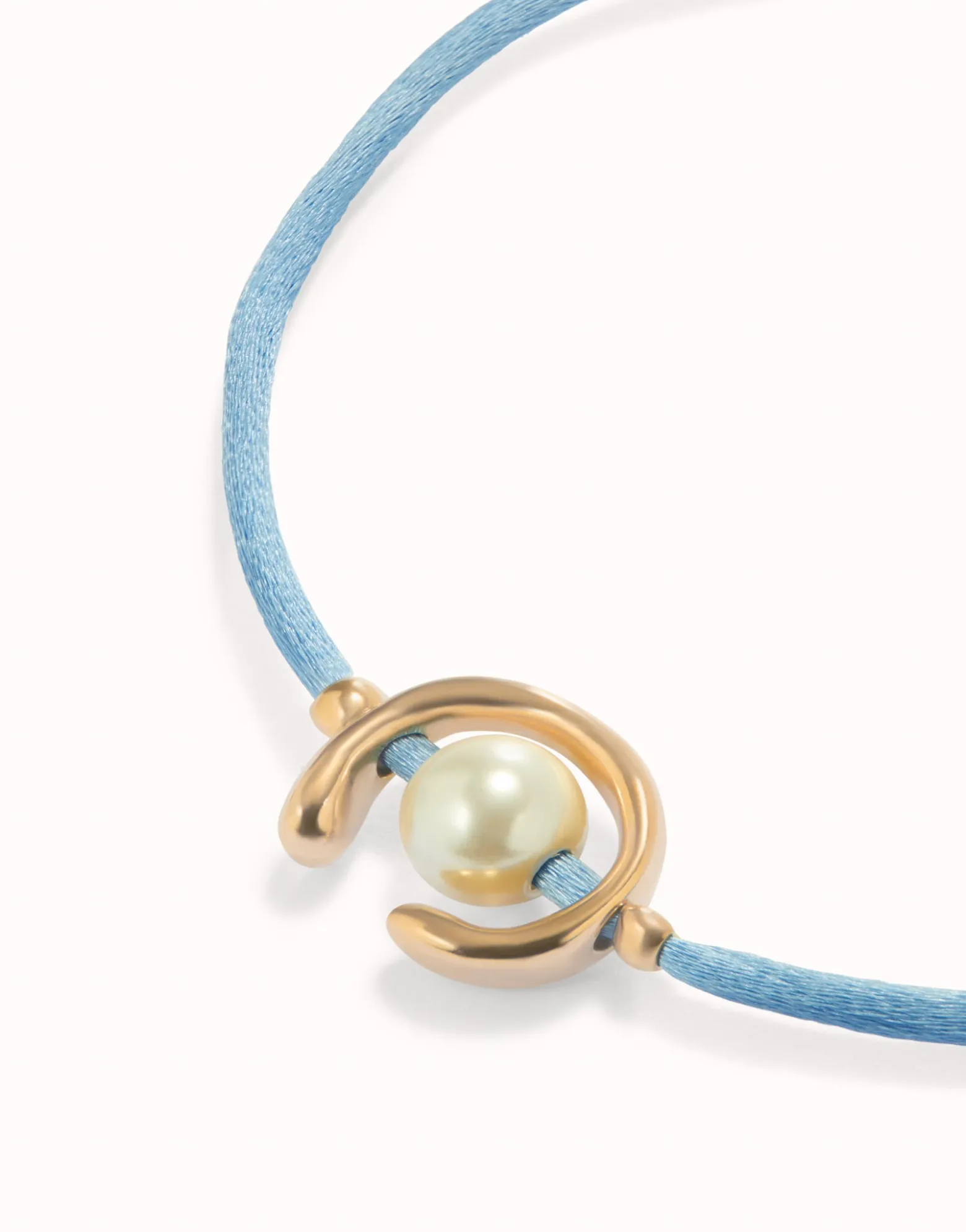 Blue cord bracelet with a pearl