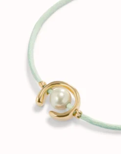 Blue green cord bracelet with a pearl