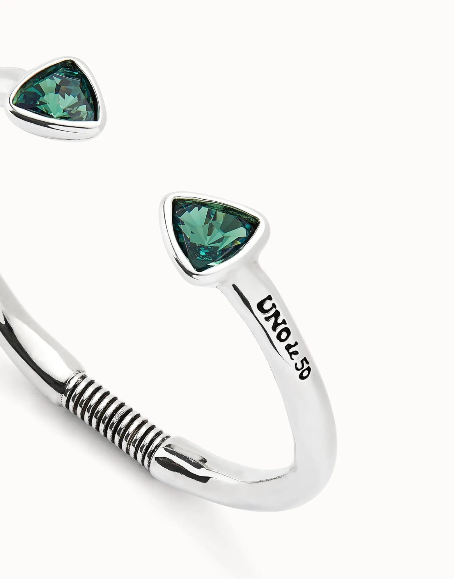 Cuff bracelet with two green crystals