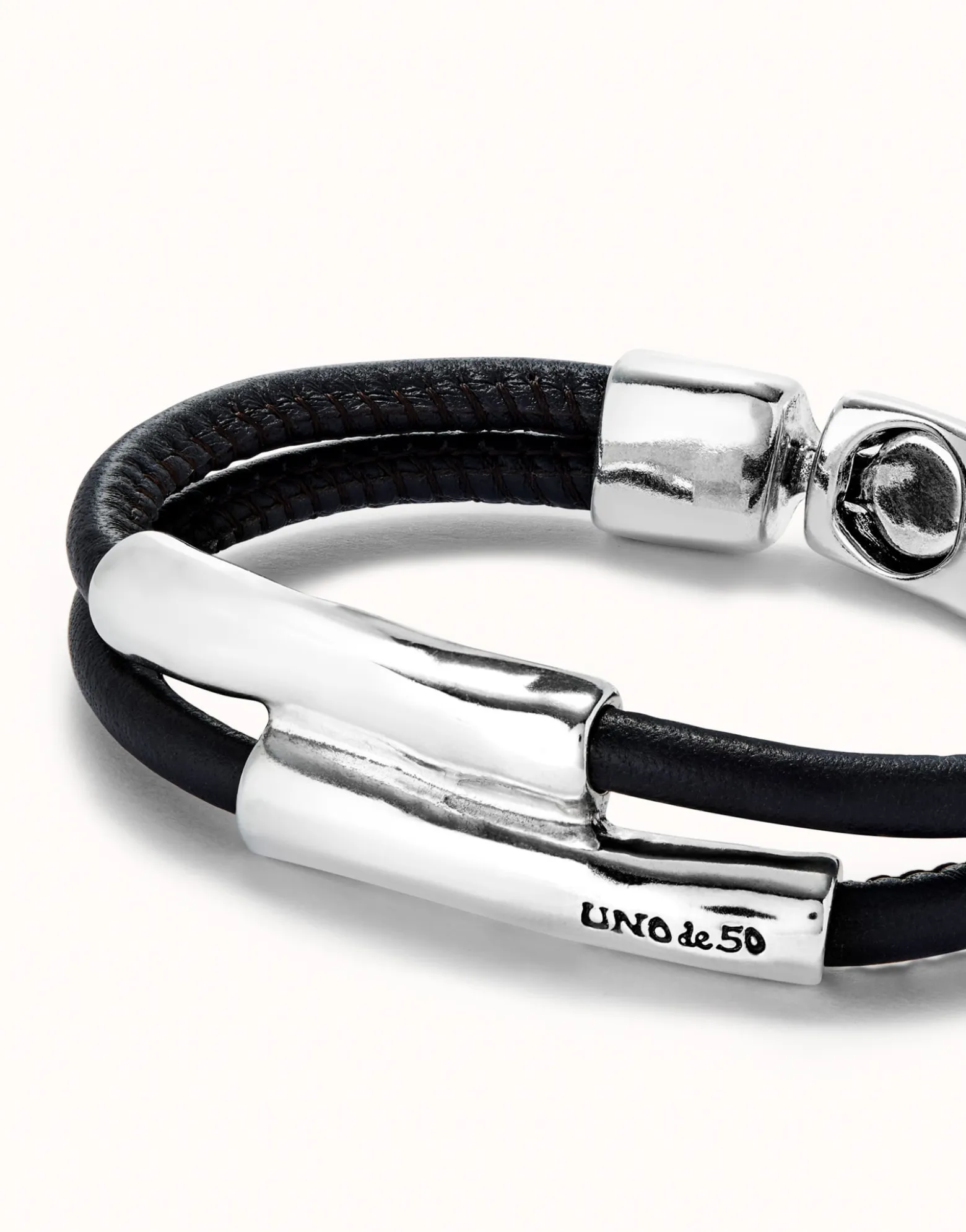 Double strand lether bracelet with two tubes