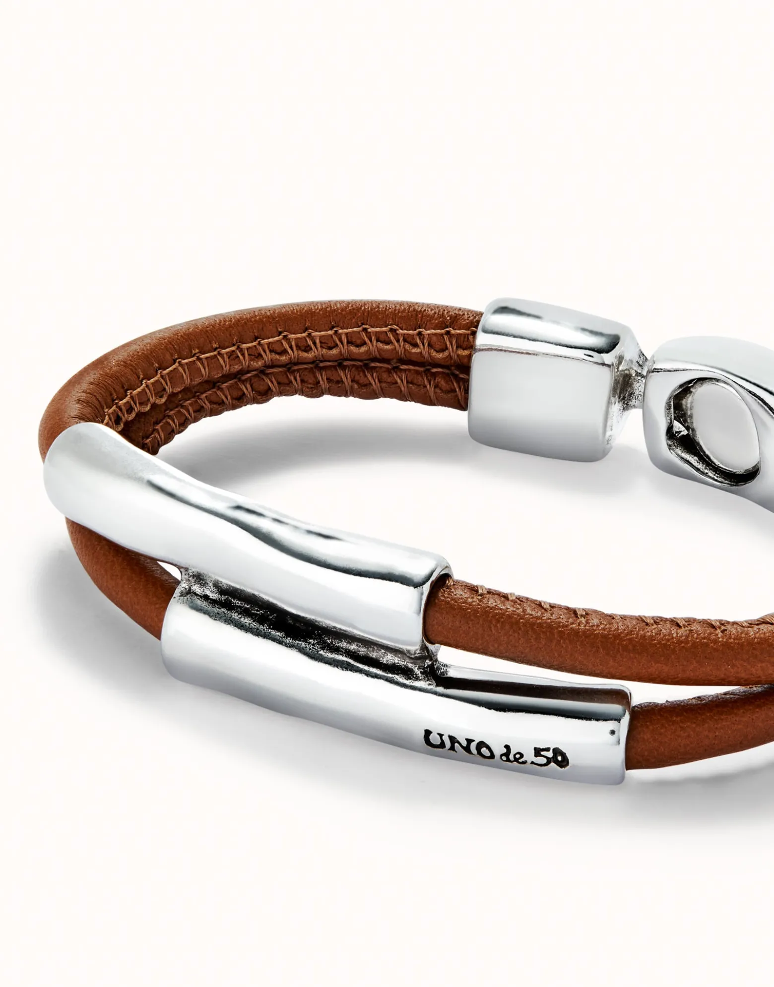 Double strand lether bracelet with two tubes