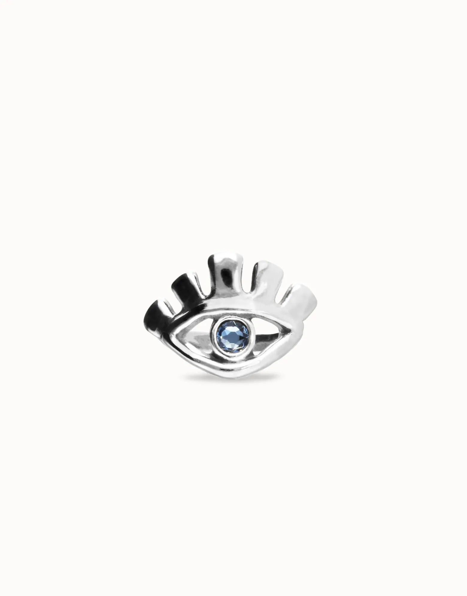 Eye-shaped ring with faceted blue crystal