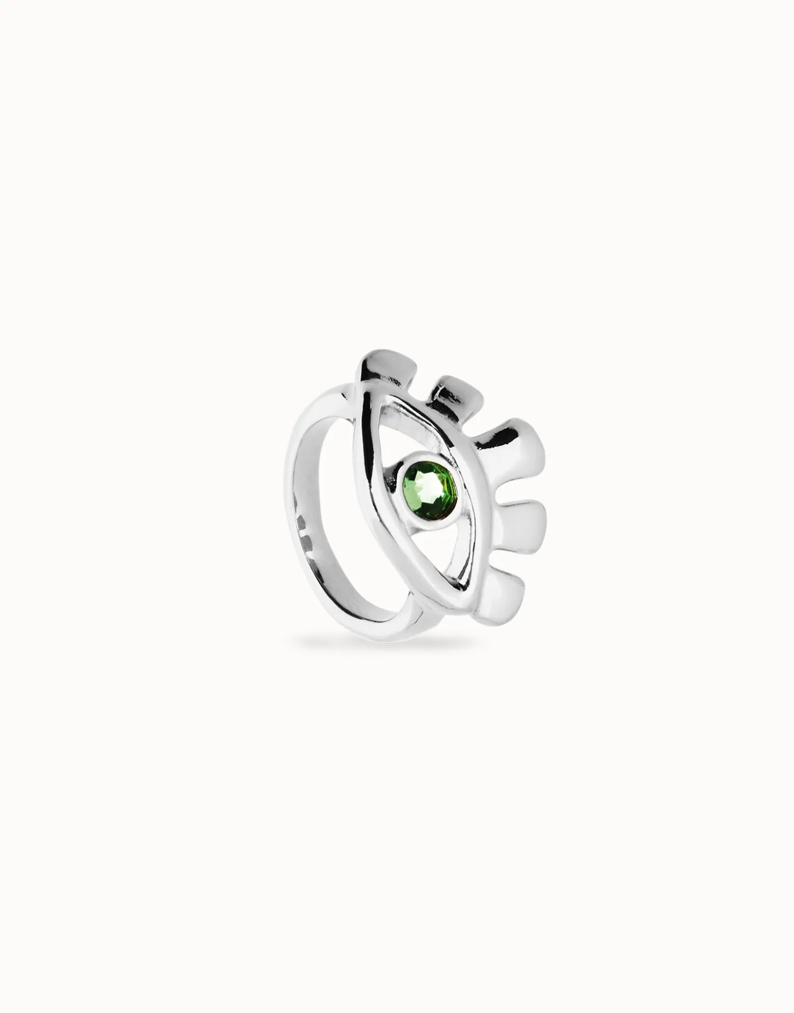 Eye-shaped ring with faceted green crystal
