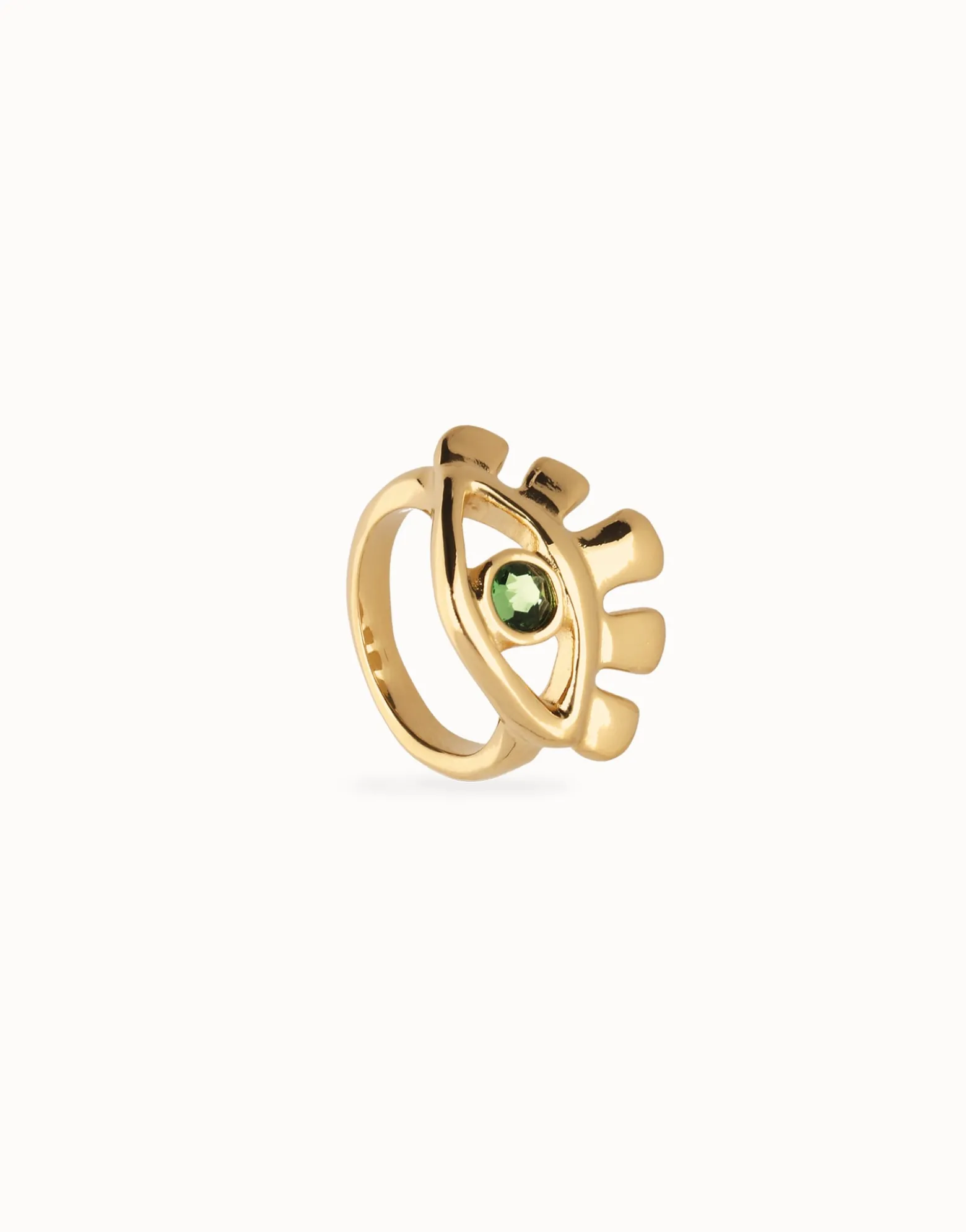 Eye-shaped ring with faceted green crystal