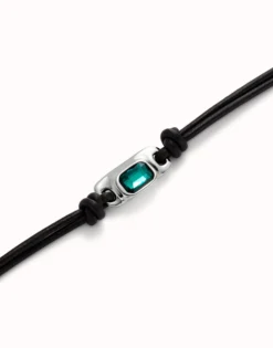 Leather bracelet with a green crystal