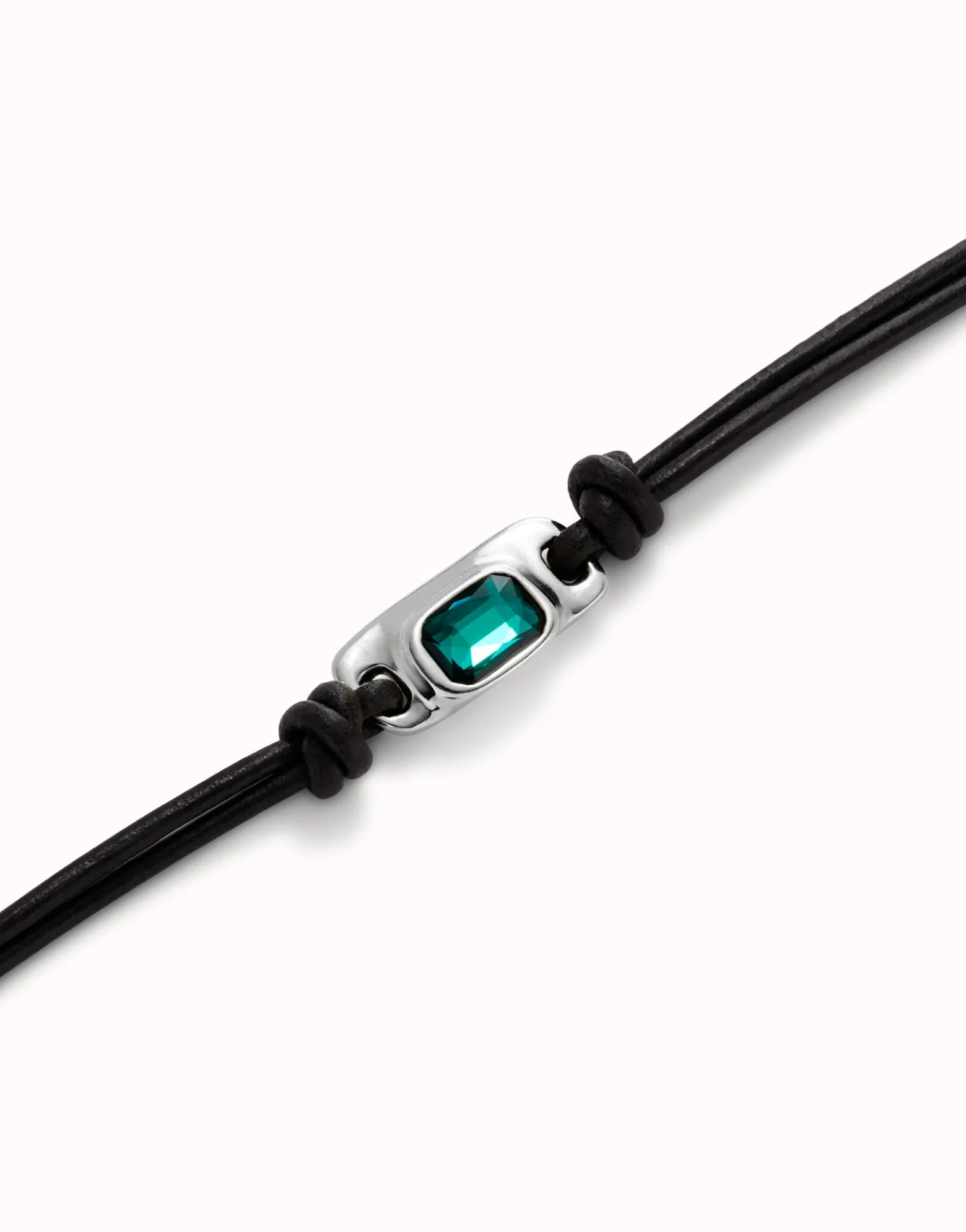 Leather bracelet with a green crystal
