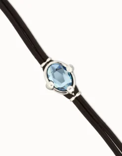 Leather bracelet with blue oval faceted crystal