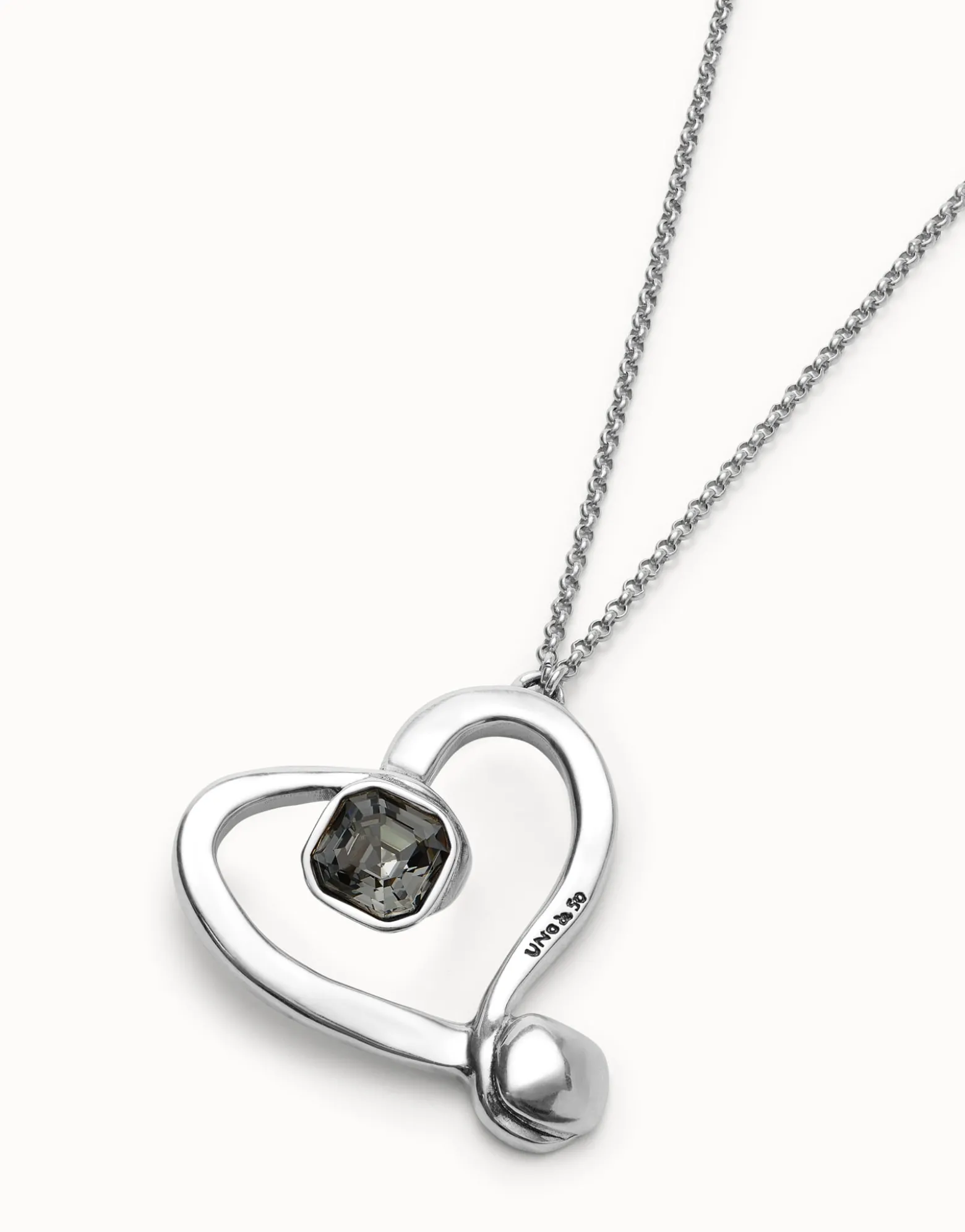 Long chain pendant necklace with a large heart