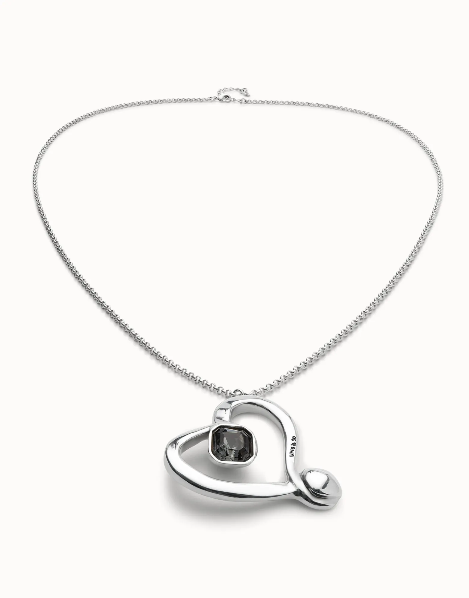 Long chain pendant necklace with a large heart