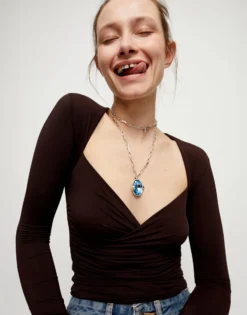 Long necklace with large blue oval faceted crystal