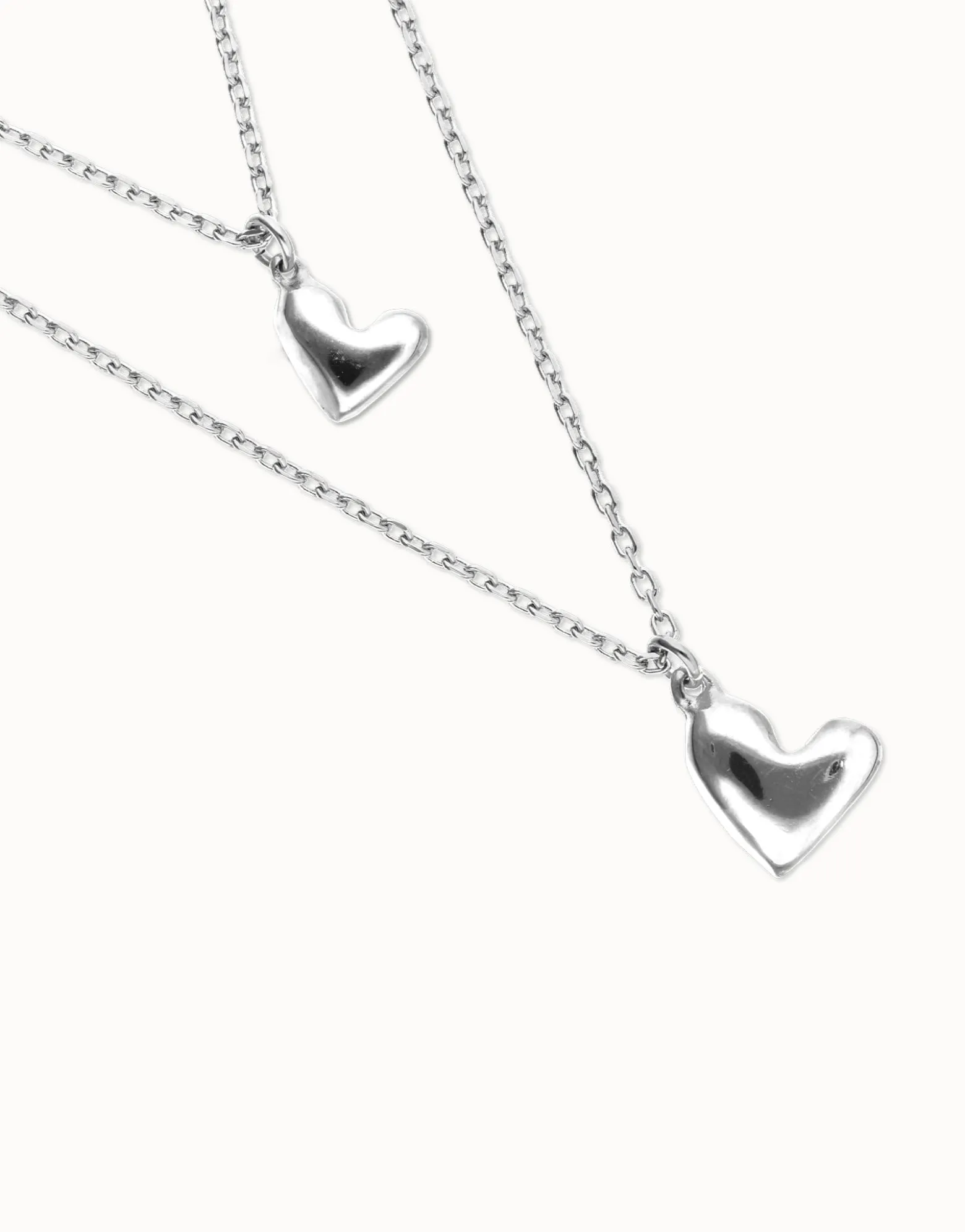Multi strand chain necklace with two hearts