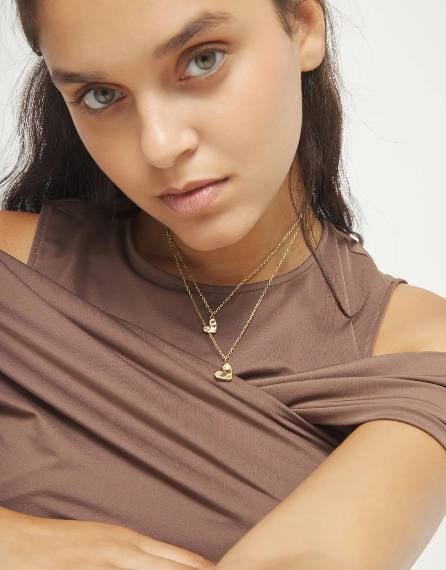 Multi strand chain necklace with two hearts