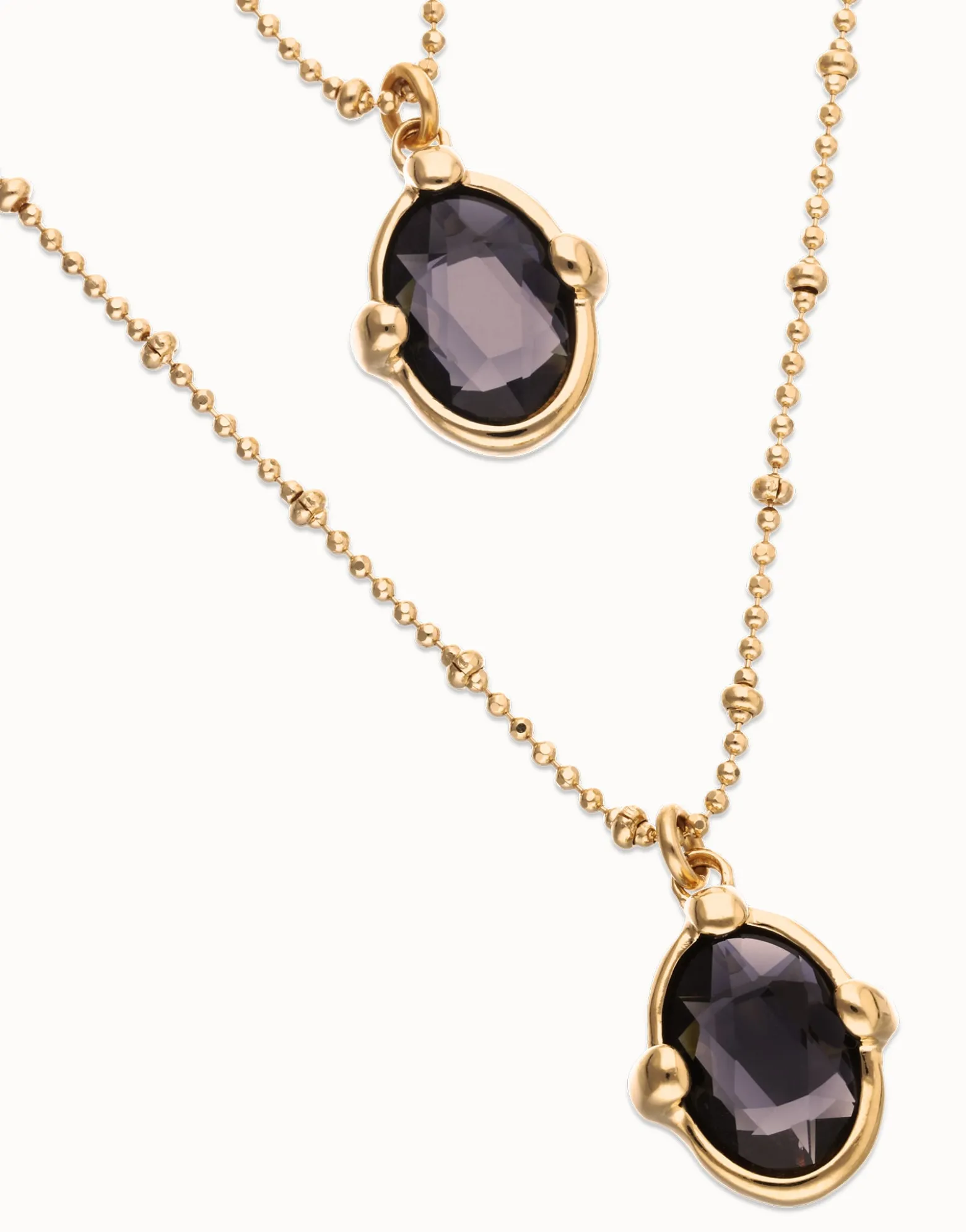 Multi strand necklace with two black oval faceted crystals
