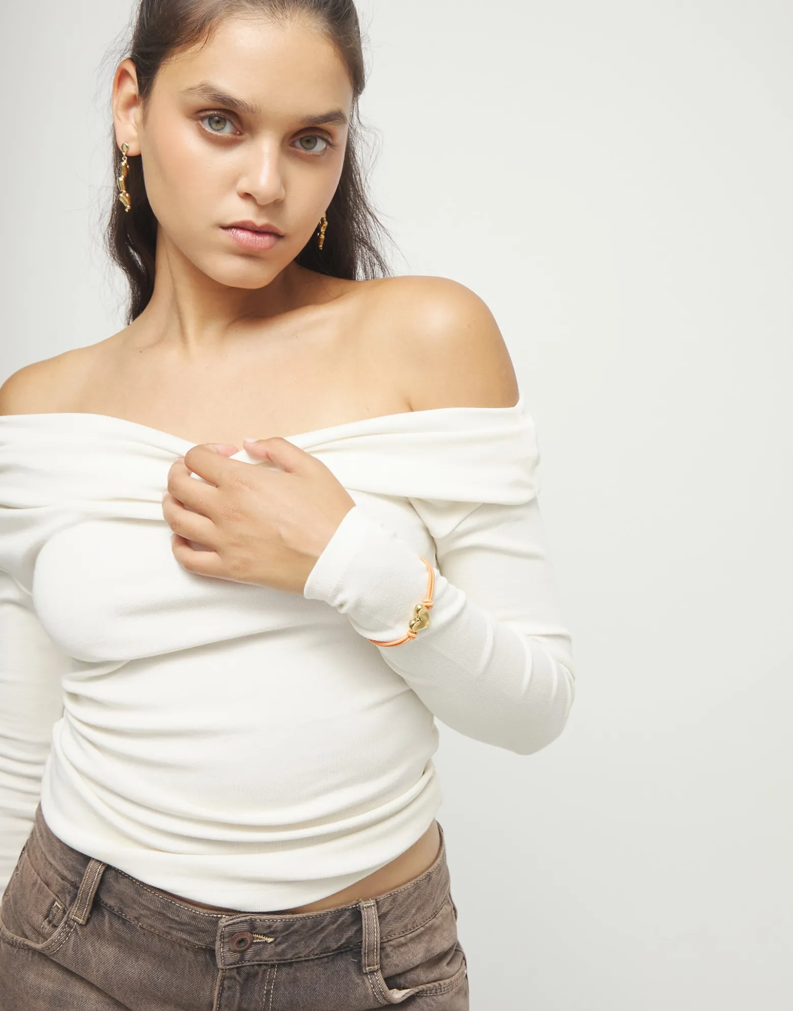 Orange elastic thread bracelet with heart