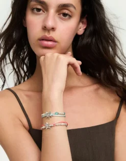 Orange silk thread and metal bracelet with starfish