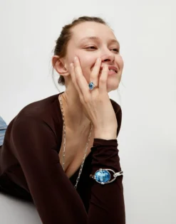 Ring with blue oval faceted crystal